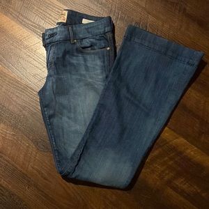 Rich jeans with flare bottom. Size 30. Fitted in seat and leg.